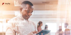 Man looking at a tablet interacting with VeryPay's white-label.
